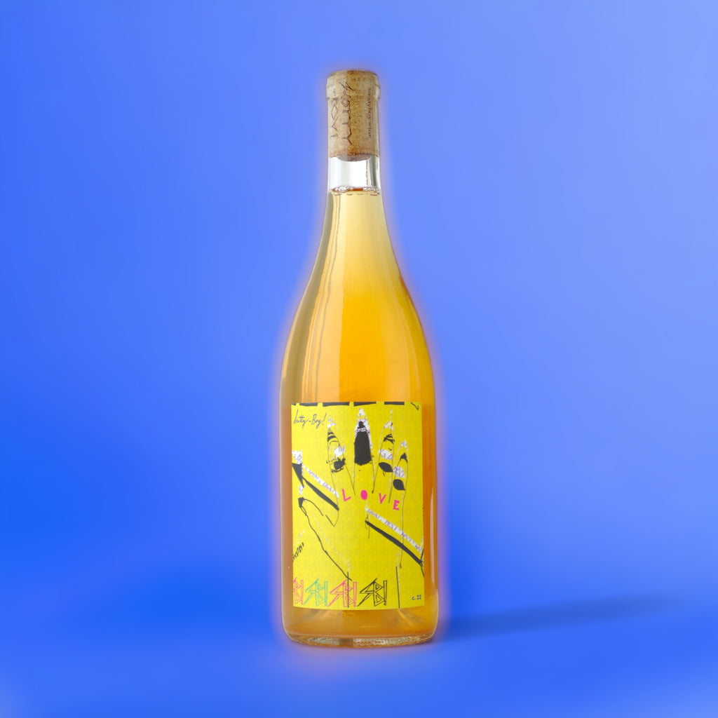 Bottle of Natural Wine, Scotty Boy Guess Who's Coming to Dinner against a bluish background.